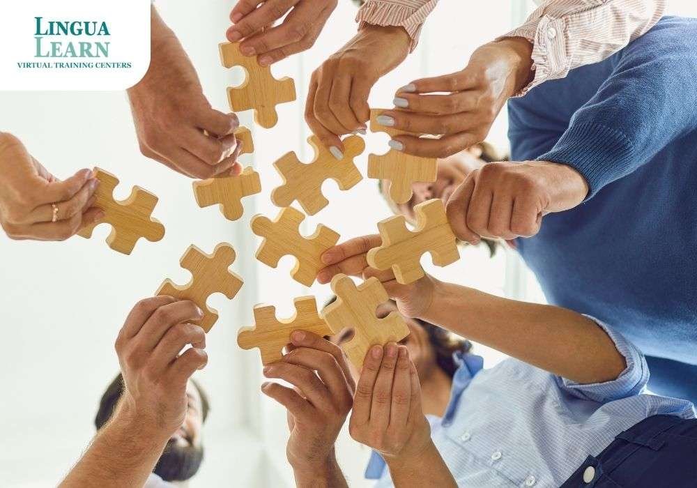 Hands of multiple people holding wooden puzzle pieces together