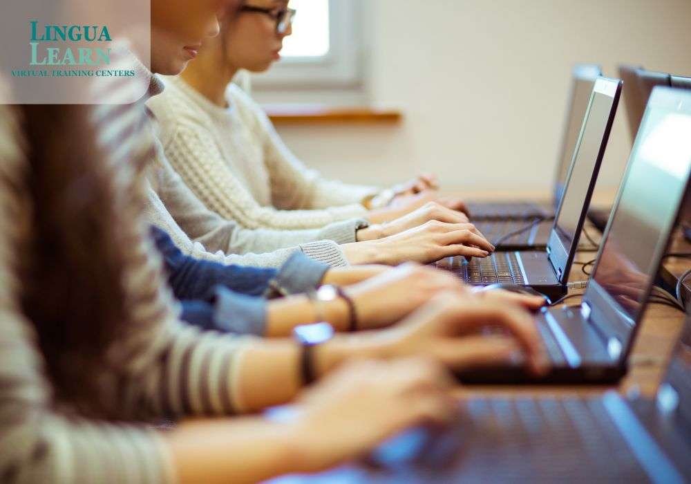 a group of people using laptops